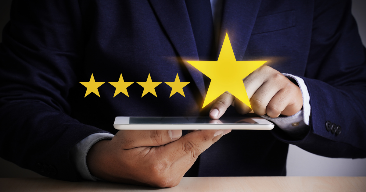 man holding cellphone with stars