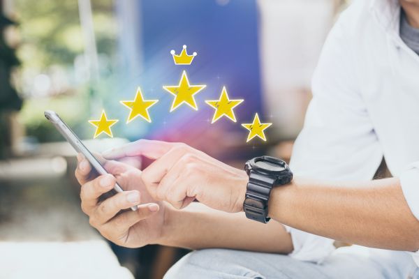 man using cellphone with stars
