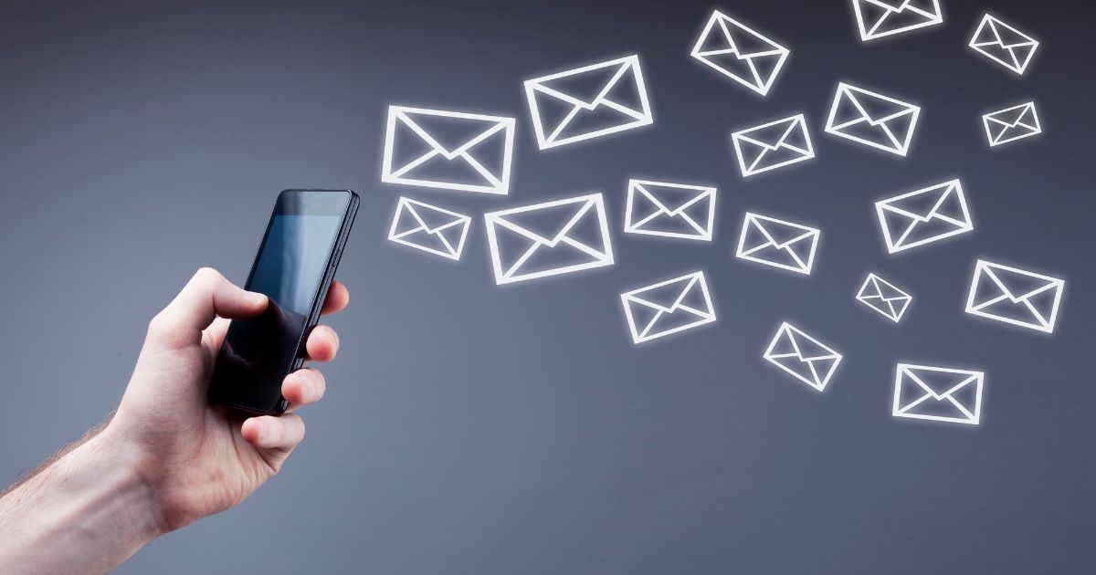 man using phone with message emoticon