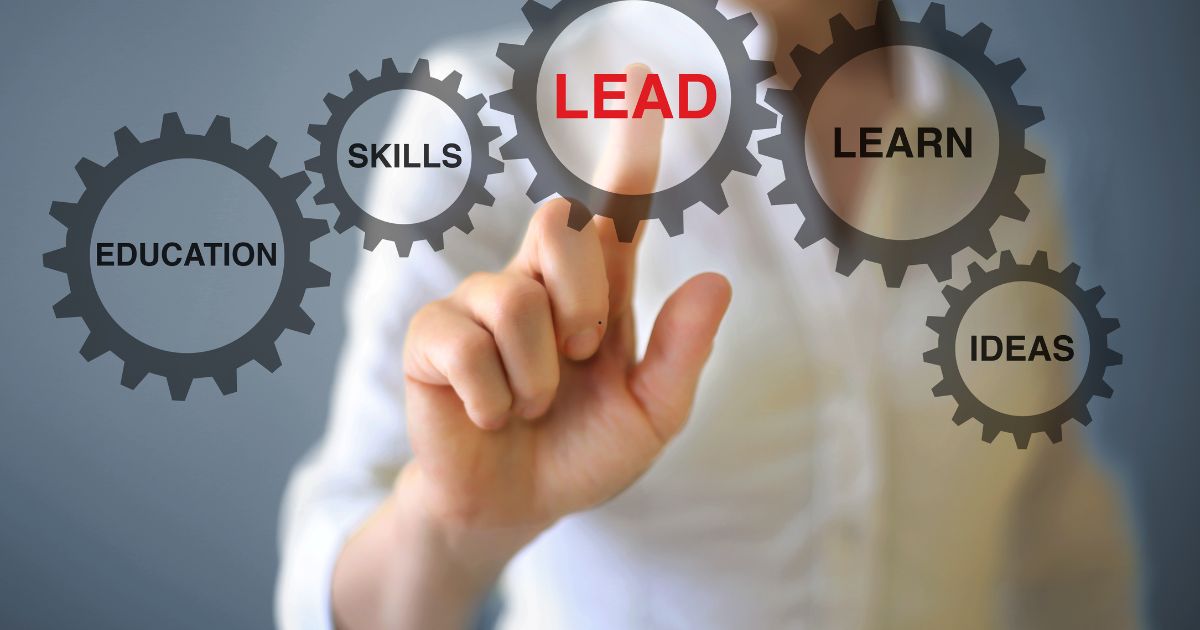 Hand pointing at a central gear labeled LEAD