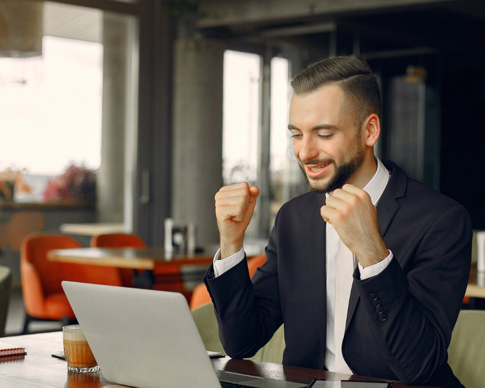 Businessman winning happily