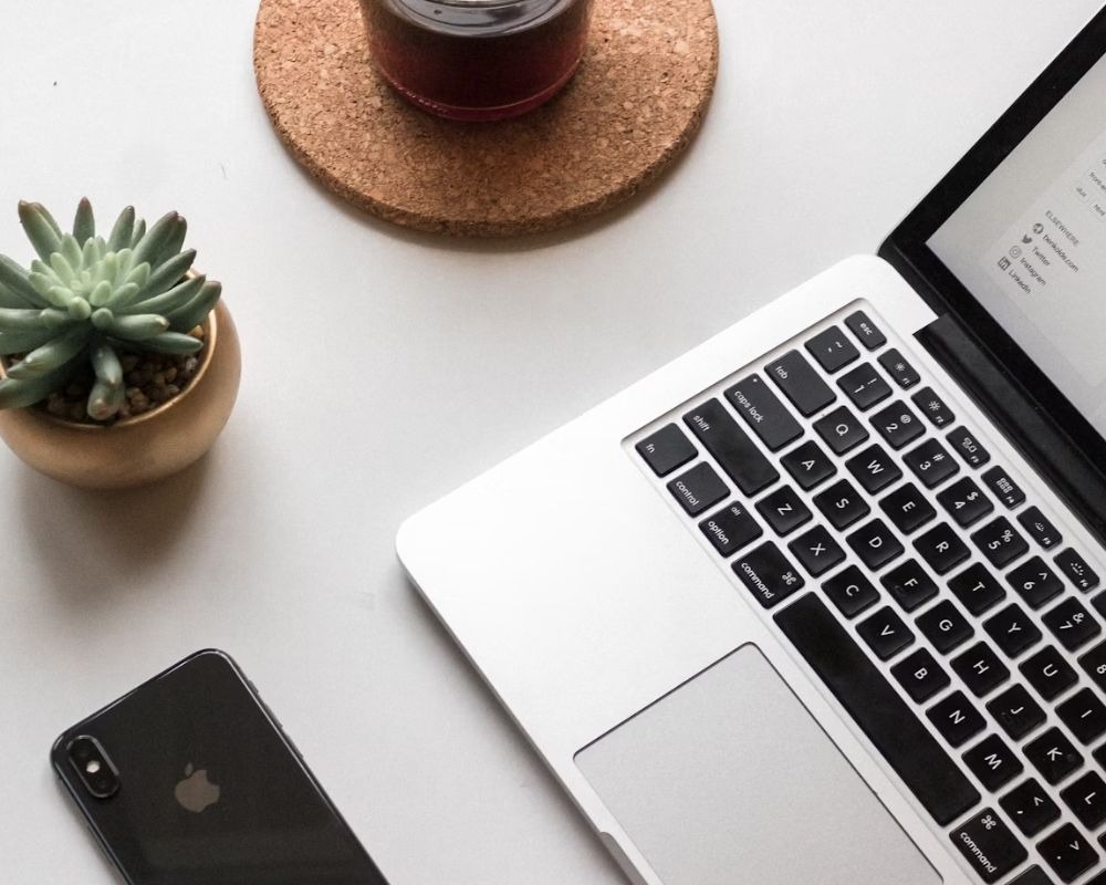 Laptop in a white desk image